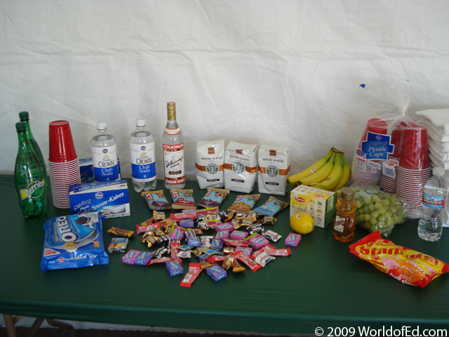A variety of snacks on a plastic table.