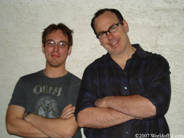 Special Ed and Greg Graffin leaning on a wall.