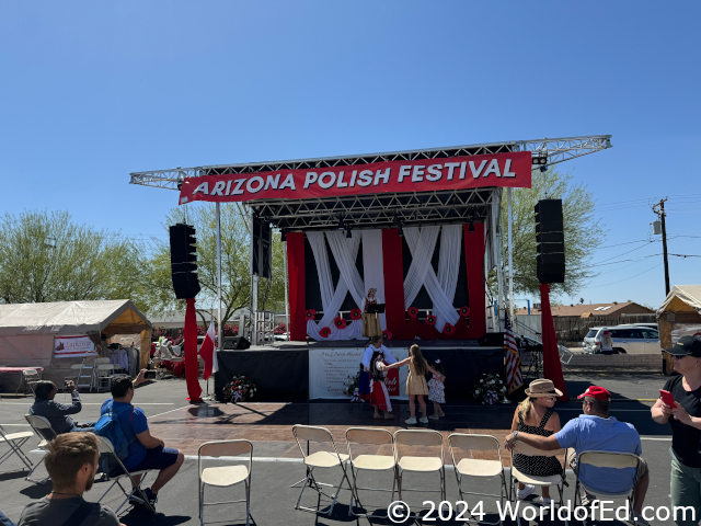 A stage with dancers preparing.