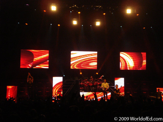Avenged Sevenfold on stage performing.