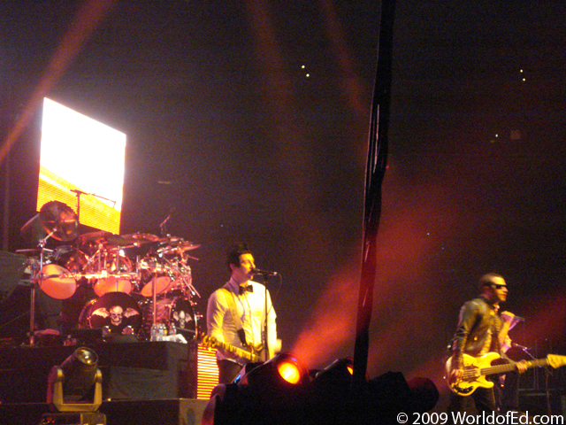 Avenged Sevenfold on stage performing.