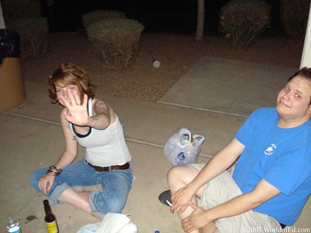 Beth and Mark sitting while Beth avoids the camera.