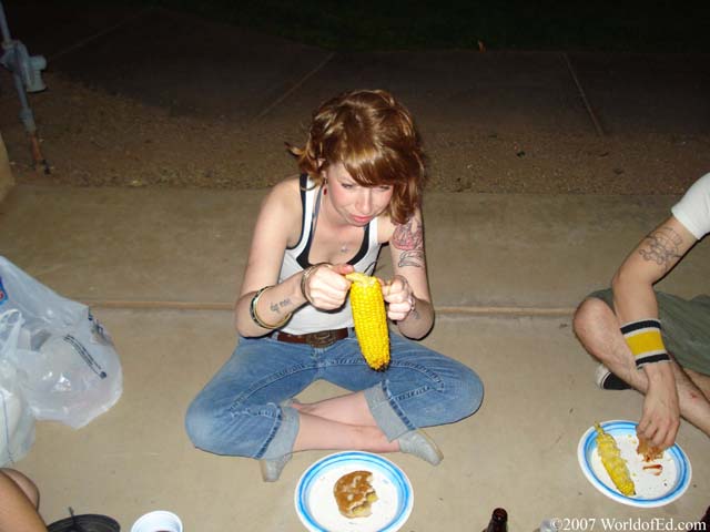 Beth opening an ear of cob.