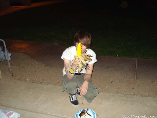 Mike Schey holding an ear of corn.