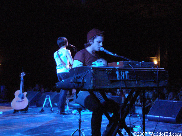 Aaron playing keyboards while Jarrod sings behind him.
