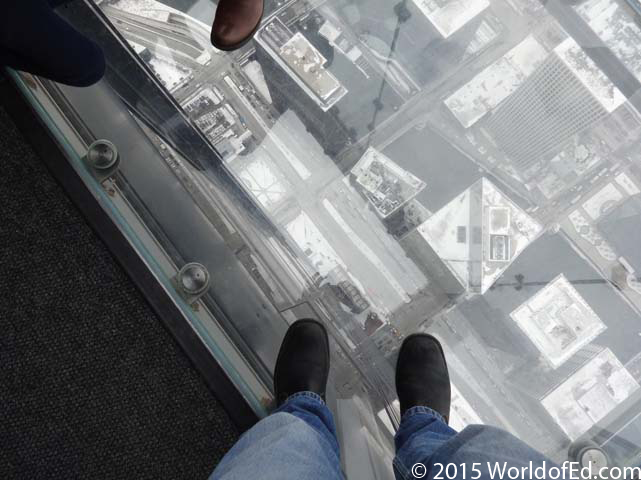 Looking down at the ground from the glass deck.