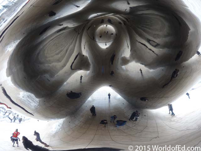A reflection of images under The Bean sculpture.