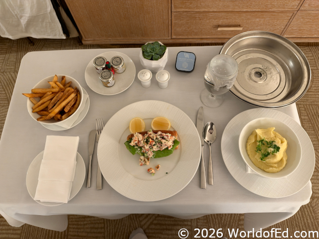 Lobster roll dinner on a room service cart.