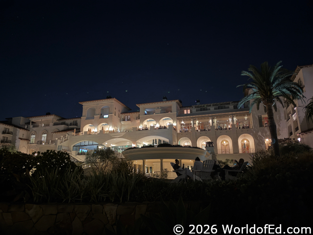 A night view from the pool looking up at the hotel.
