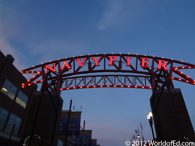 A neon Navy Pier sign at the entrance.