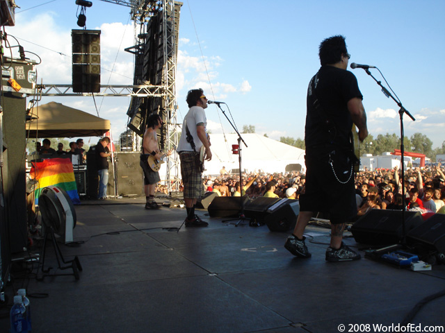 NOFX on stage performing.