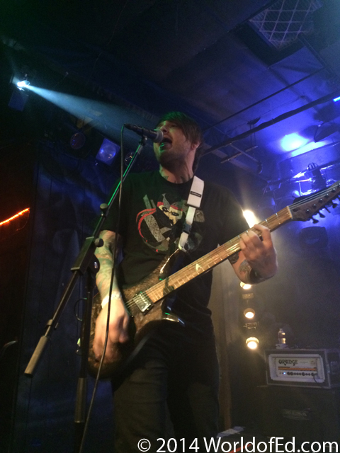Matt Good playing guitar on stage.