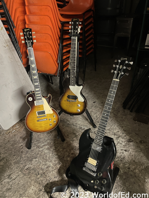 Guitars in stands.