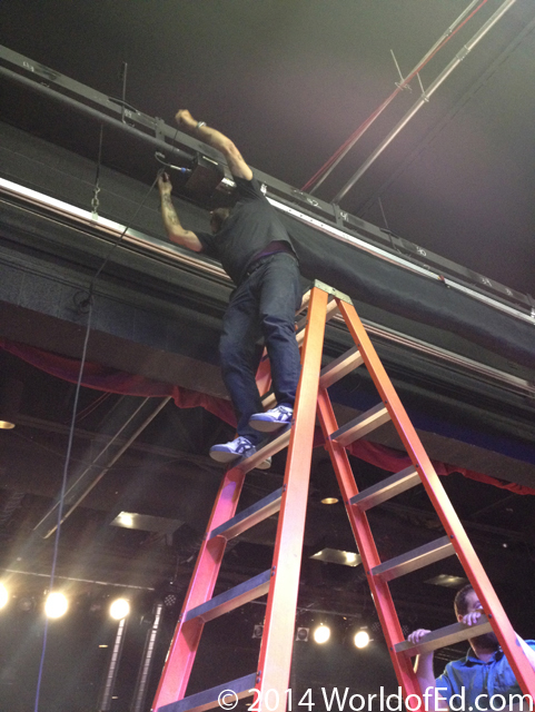 Ron Kimball standing on a ladder.