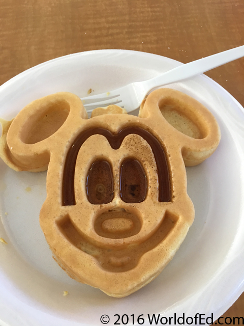 A waffle with the shape of Mickey Mouse.