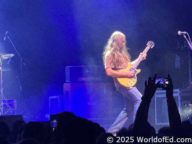 Mark playing his guitar.