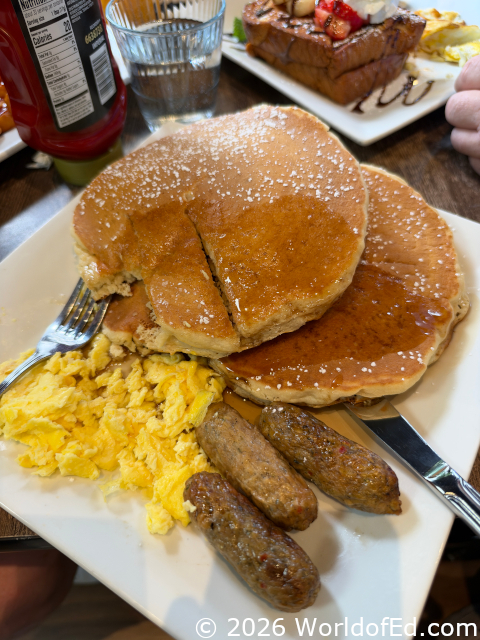 A large pancake breakfast on a plate.