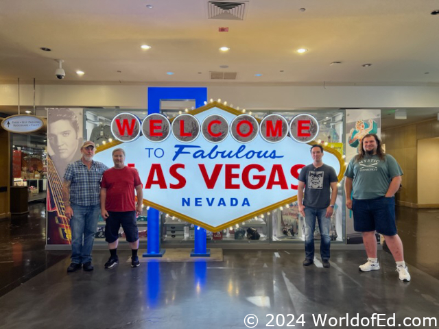 Friends in front of a Las Vegas sign.