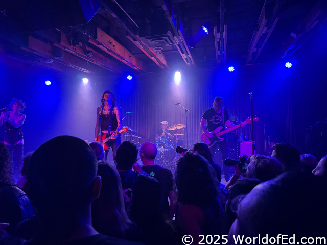 Mike backlit while drumming.