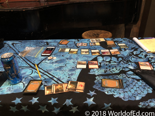Magic cards being played on a table.