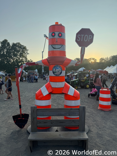 A figure made from traffic barricades.