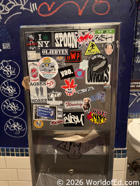 A World of Ed sticker on a towel dispenser.
