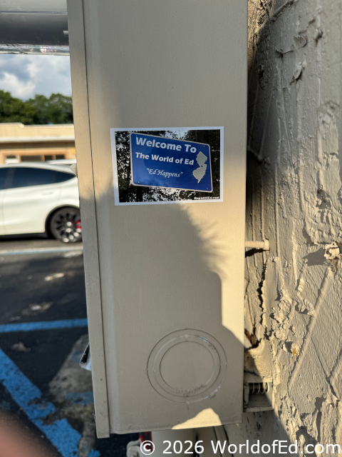 Q World of Ed sticker.