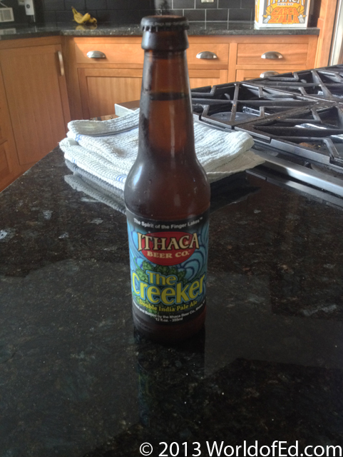 A bottle of Ithaca Beer on a granite countertop.