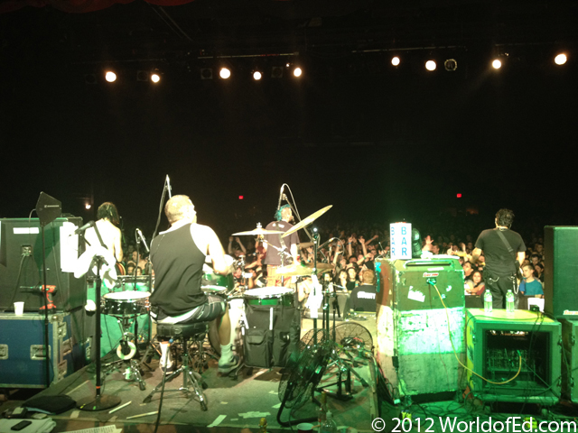 NOFX on stage performing.