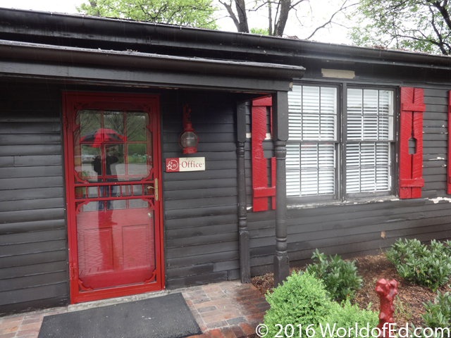 The exterior of a wood office at the distillery.