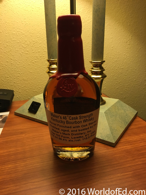 A bottle of Makers 46 Cask Strength on a hotel desk.