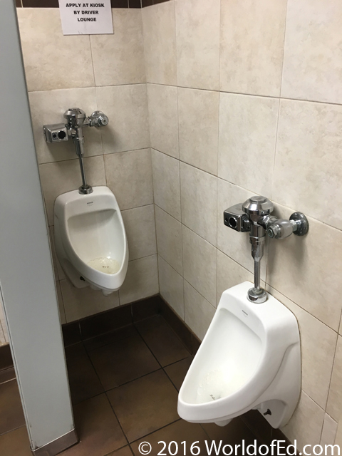 Two urinals in a truck stop.