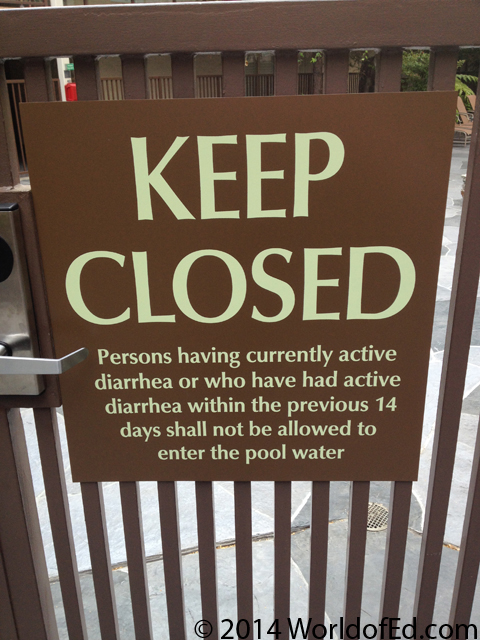 A warning sign on a pool gate.