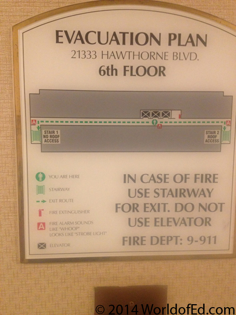 An emergency exit sign in a Hilton hotel.