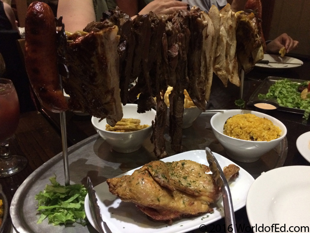 A variety of meats on a restaurant table.