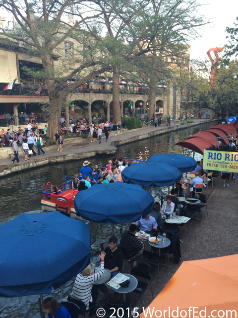 People eating along the Riverwalk.