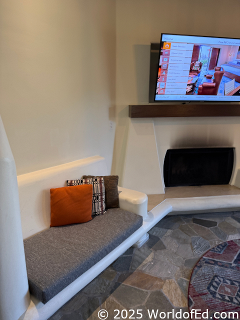 A concrete bench that is built into the wall.