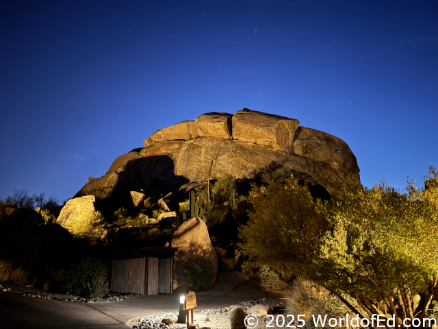 Stacked boulders with a setting sun.