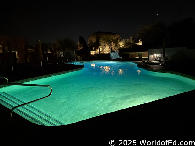 An illuminated pool at night.