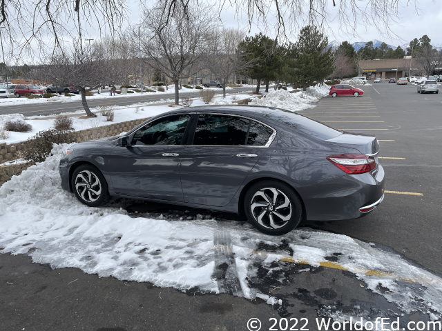 A Honda Accord parked in snow.