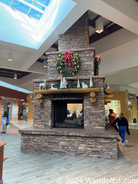 A fireplace in a mall corridor.