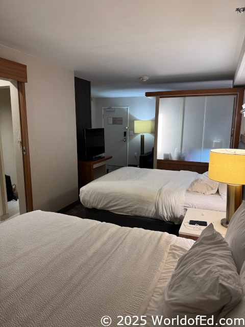 2 hotel beds in the foreground.