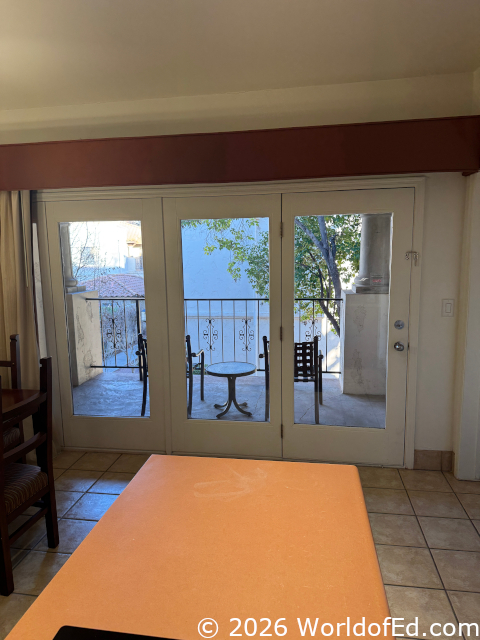 A large outdoor patio as seen from inside.