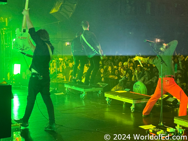 Daniel holding up his bass.