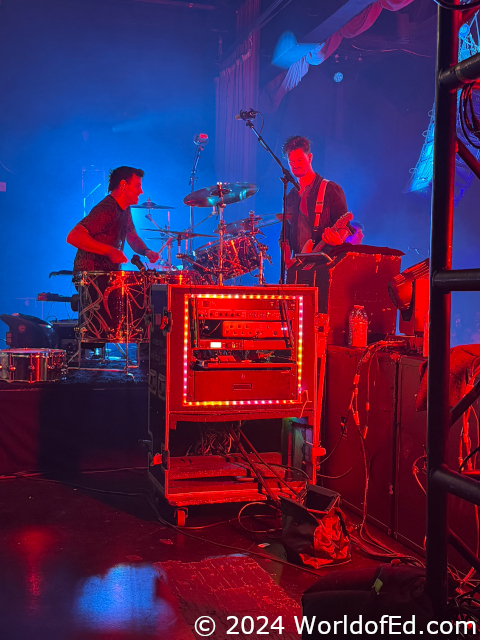 Steve drumming and Jason on the riser.