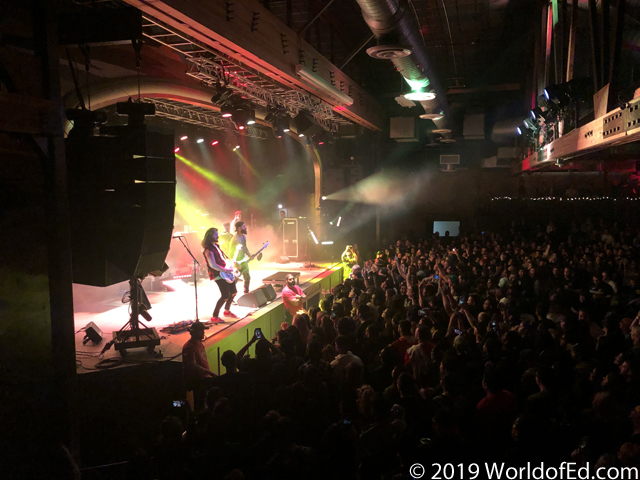 Senses Fail on stage performing as seen from the crowd.