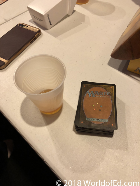 Makers Mark 46 and Magic cards on a table.