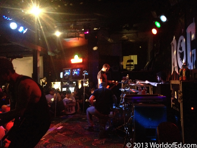 Senses Fail on stage checking their gear.