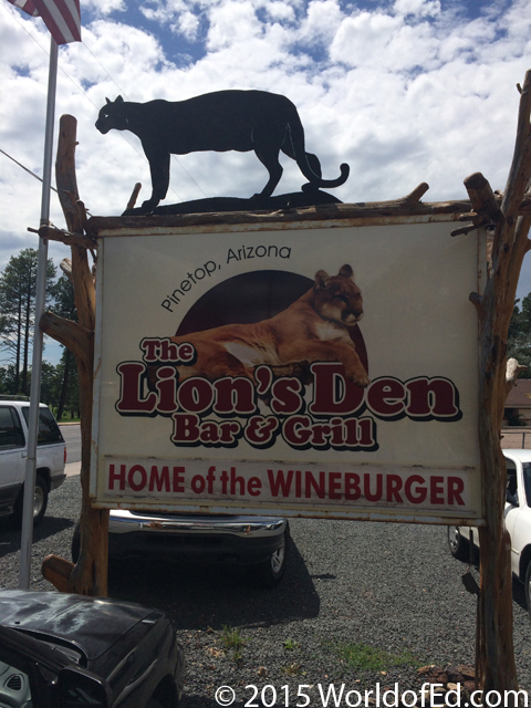 A sign advertising the Lion's Den restaurant.