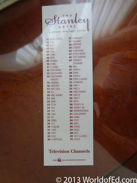 A tv channel list on a nightstand.